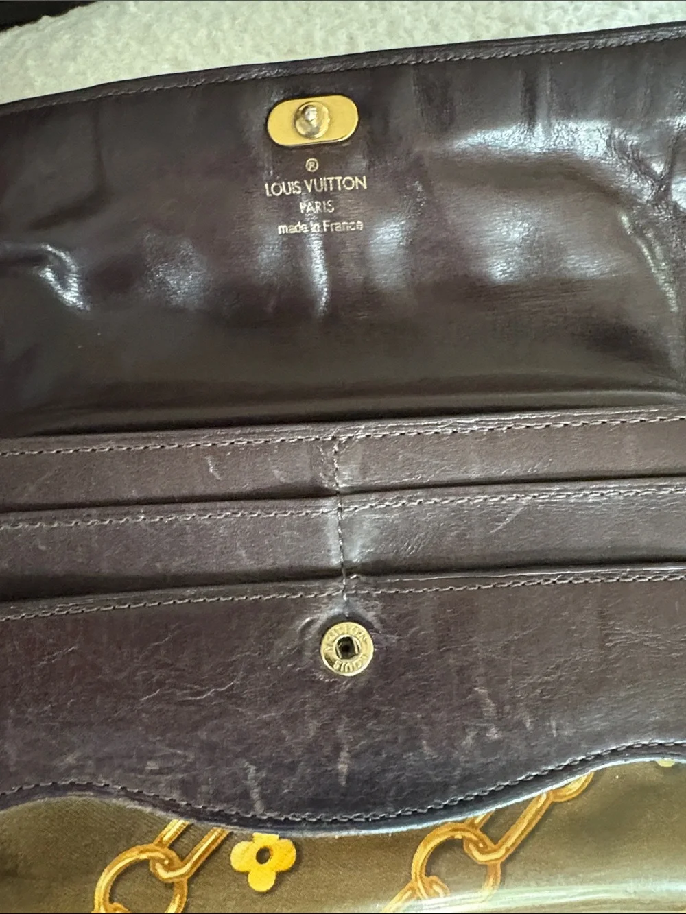 Louis Vuitton Monogram Charms Porte-Monnaie Wallet in brown (7.5 x 4in.)